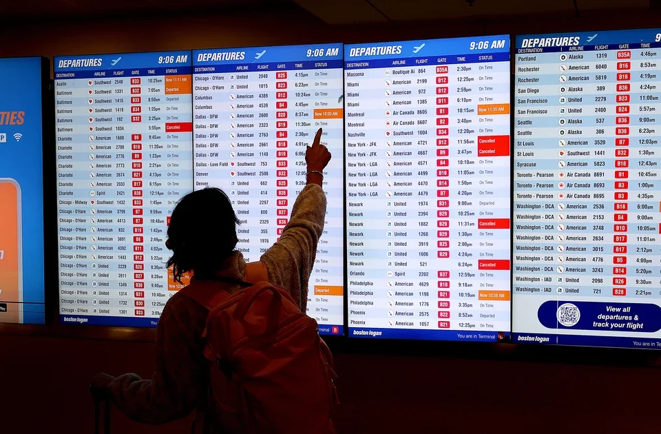 traveler looking at flight status